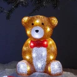 Ours lumineux marron assis avec noeud rouge